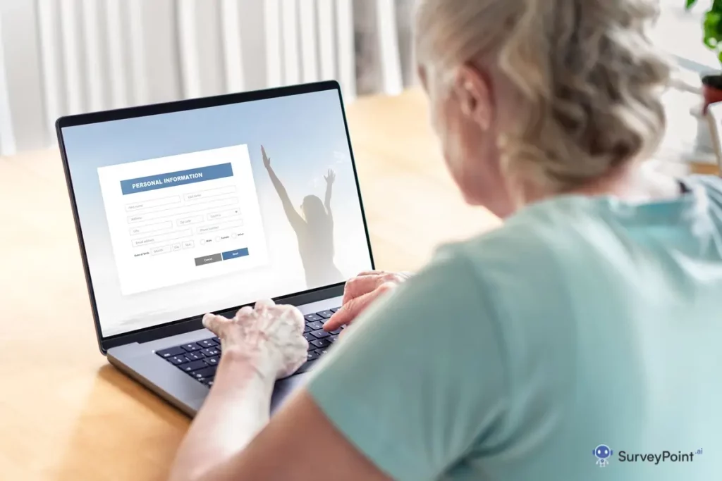 A woman sitting at a desk, using a laptop to apply for a job.