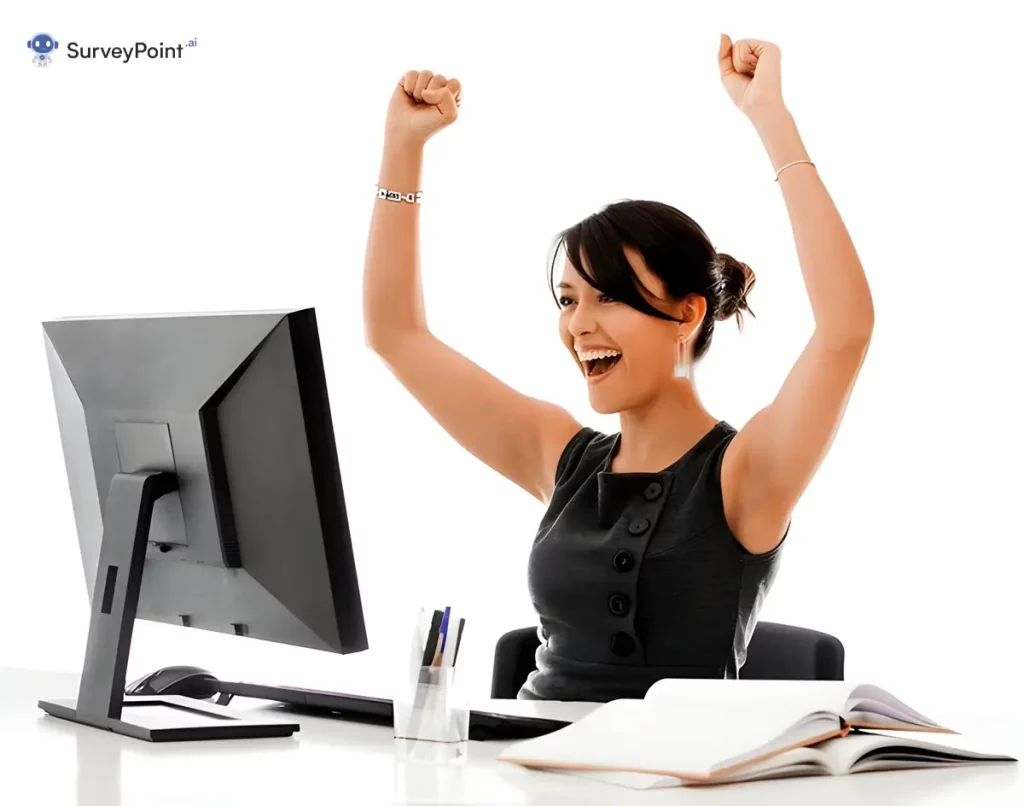 Woman sitting at desk with arms up, Survey Targeting.