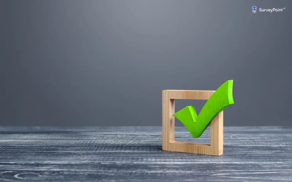 A green check mark rests on a wooden table, symbolizing success, with ample copy space for text related to the Problem Behavior Survey.