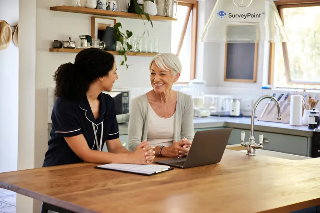 Two women, one younger and one older, sit at a kitchen table discussing topics related to a cooking survey.