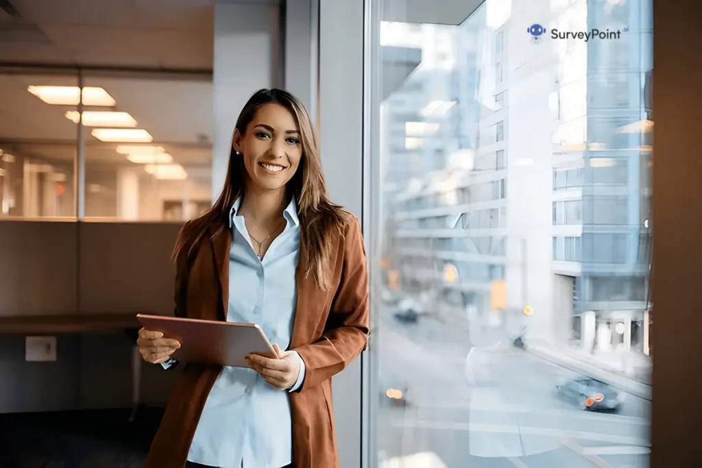 A professional woman in a business suit is holding a tablet, engaged in the Elementary Reading Survey.