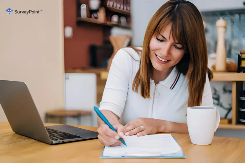 A woman diligently writes on a piece of paper with a pen, participating in a text message survey.