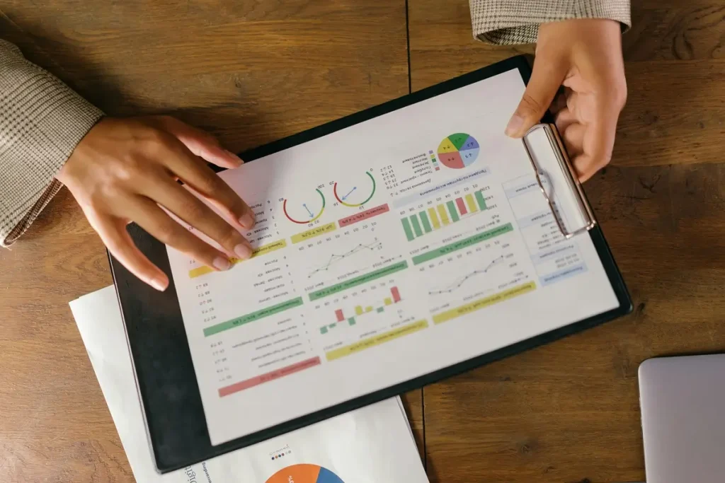 Businesswoman analyzing financial data on a tablet, showcasing a professional work environment and digital engagement